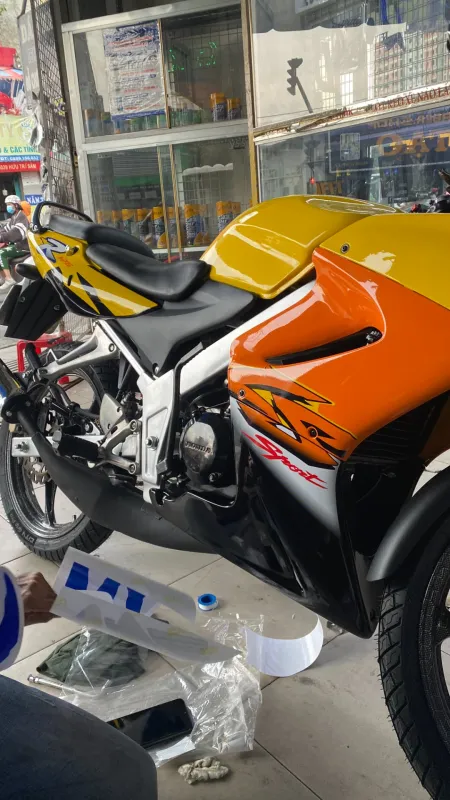 Áo vàng cam Honda LS 125 tem Sport
